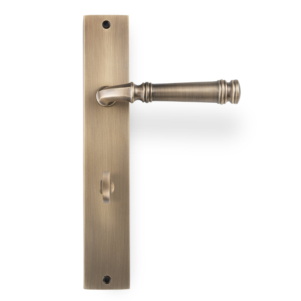 Tuscany Lever on Rectangle Privacy Plate in Antique Brass – classic privacy door handle for traditional and Hamptons-style interiors.