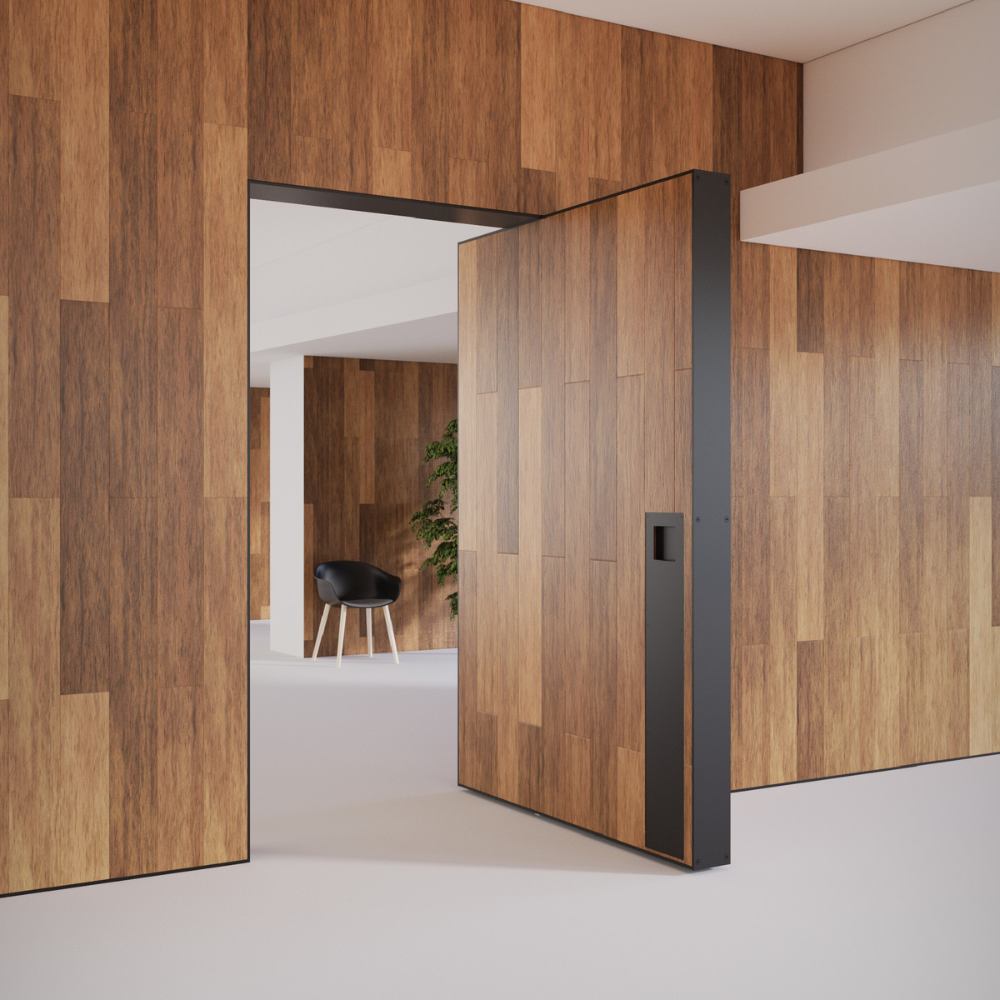 Picture of a large wooden door holding open at 90 degrees with polished concrete floors.