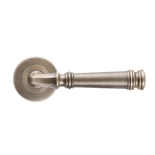 Tuscany Lever on Rose in Antique Brass – traditional front door handle finish for heritage and Hamptons-style homes.